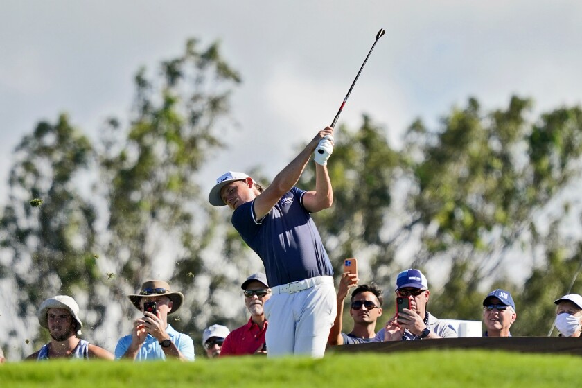 Cameron Smith plays his shot from the 11th tee during the second round of the Tournament of Champions golf event, Friday, Jan. 7, 2022, at Kapalua Plantation Course in Kapalua, Hawaii. (AP Photo/Matt York)