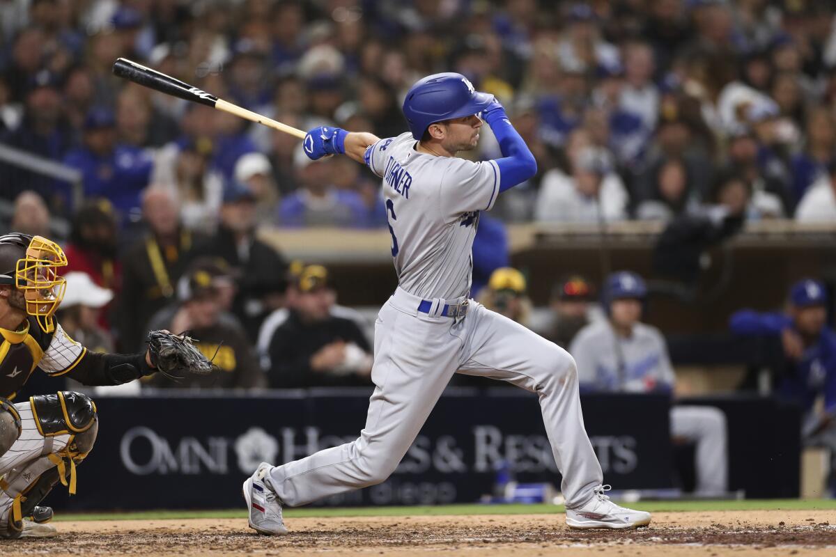 The Dodgers' Trea Turner connects for a two-run double in the eighth inning April 23, 2022.