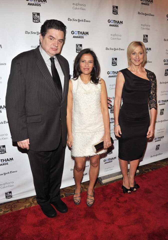 Host Oliver Platt, executive director of the Independent Filmmaker Project, Joana Vicente and host Edie Falco attend the IFP's 21st Gotham Independent Film Awards at Cipriani Wall Street in New York City. "Beginners" and "Tree of Life" tied for the night's top honor.