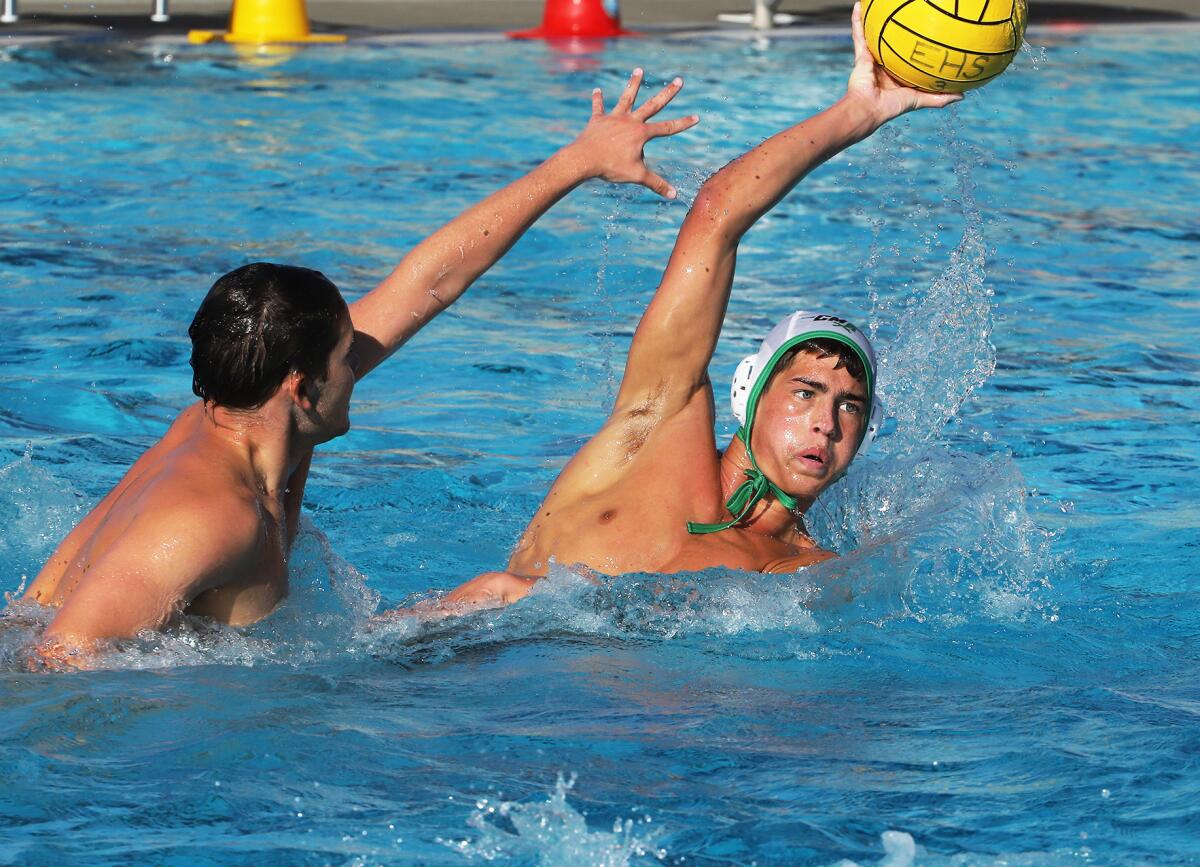Costa Mesa's Wes Brazda (4) looks for a shot during Wednesday's match at rival Estancia.