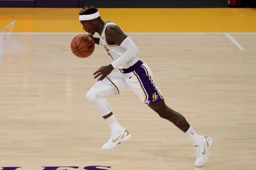 LOS ANGELES, CALIF. - FEB. 28, 2021. Lakers guard Dennis Schroder pushes the ball upcourt against the Warriors during Sunday night's game, Feb. 28, 2020, at Staples Center in Los Angeles. (Luis Sinco/Los Angeles Times)