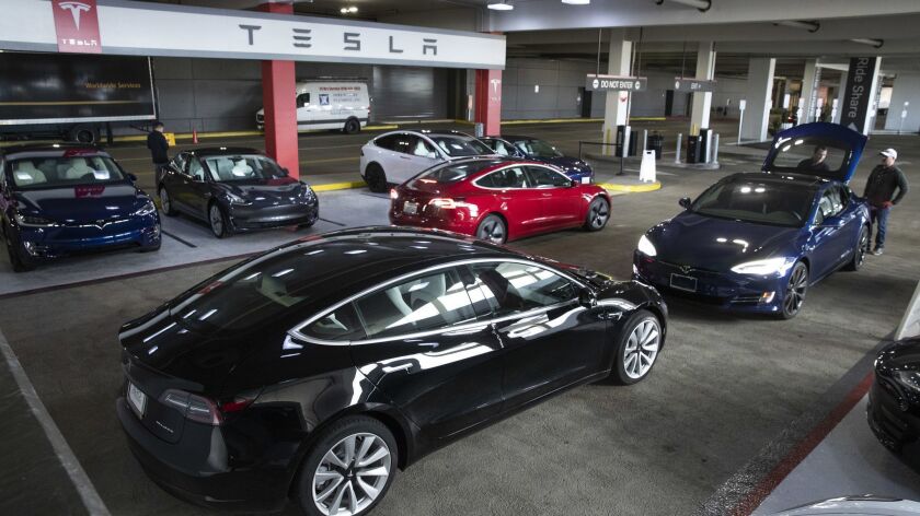 New Tesla vehicles available for sale are pictured in the parking garage of the Westfield Topanga shopping center in Canoga Park.
