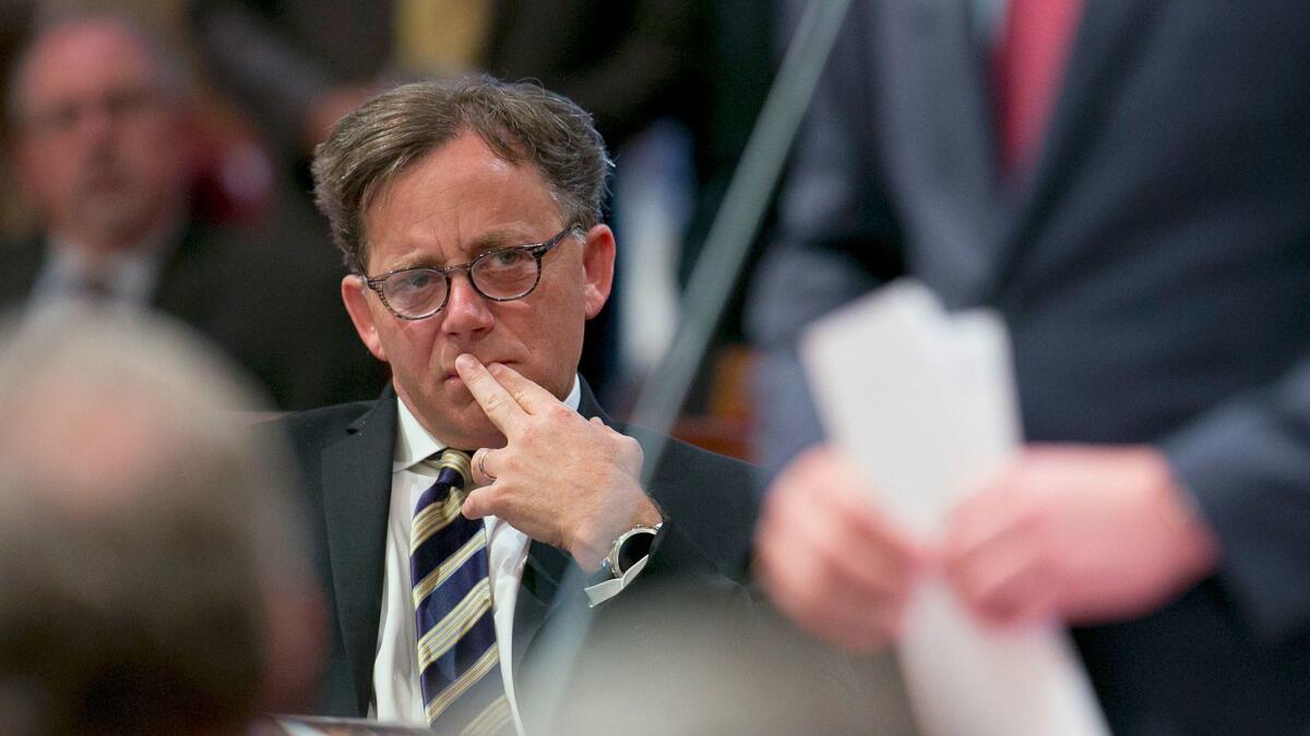 State Sen. Josh Newman (D-Fullerton), left, listens to debate in June on a measure to change the rules governing recall elections.