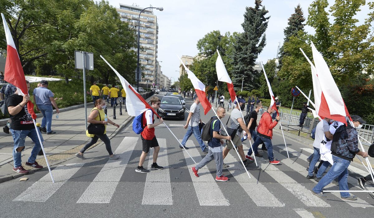 Polish farmers take part in a demonstration against a proposed ban on fur farms and kosher meat exports in Warsaw, Poland, Wednesday, Sept. 16, 2020. (AP Photo/Czarek Sokolowski)
