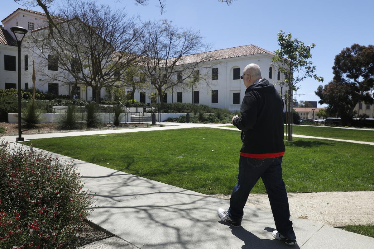 Robert Keakemety, 69, an Air Force veteran, walks toward the VA's West Los Angeles Campus.