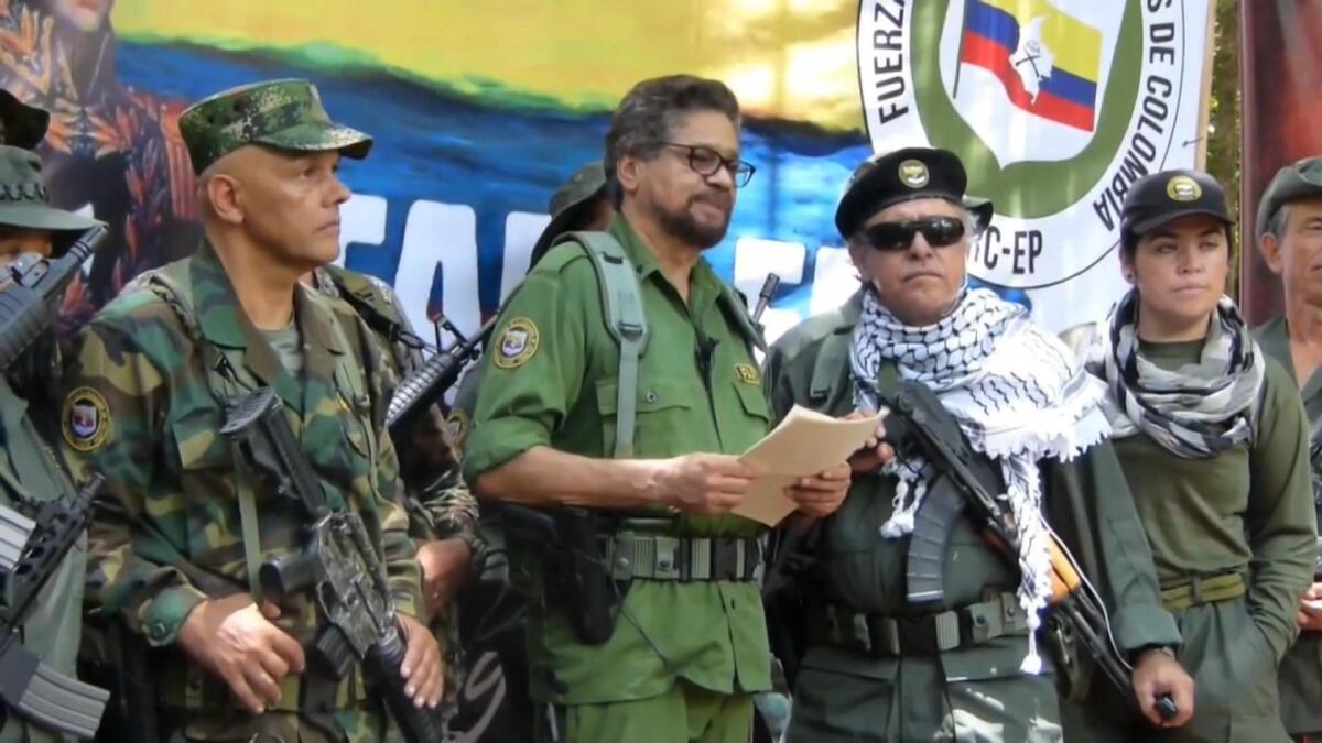 Former Revolutionary Armed Forces of Colombia commander Ivan Marquez, center, said in a recent video message that he would fight the government for better conditions for ex-combatants.