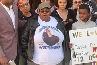 Sheryln Haynes (center), whose son Christopher Deandre Mitchell was killed by two Torrance police officers 