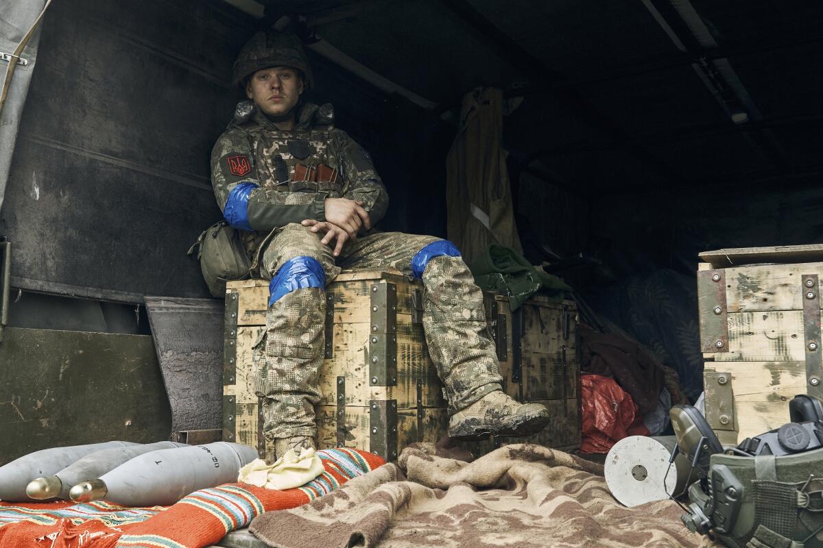 Ukrainian soldier sitting inside a truck