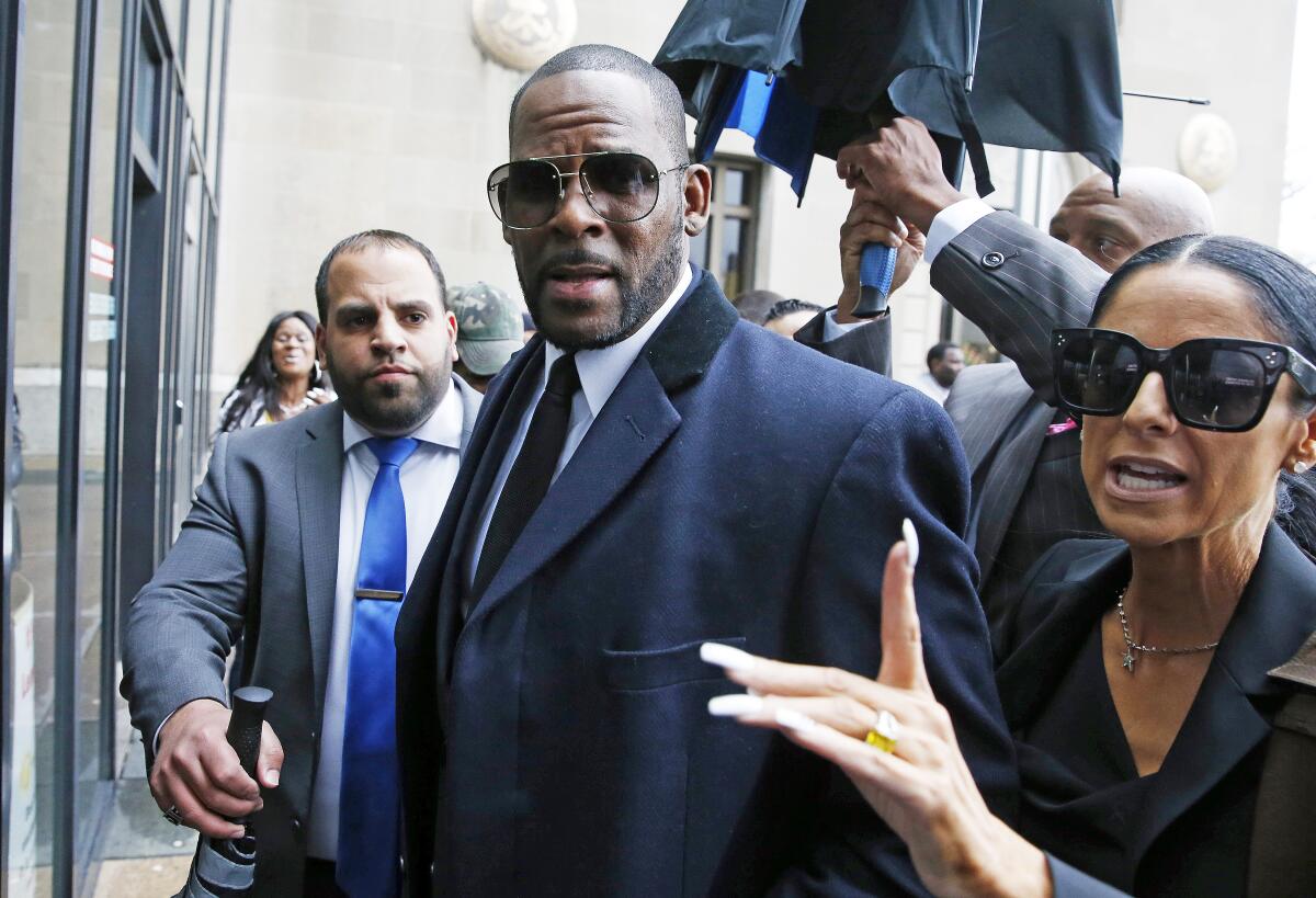 R. Kelly walks outside a courthouse in Chicago