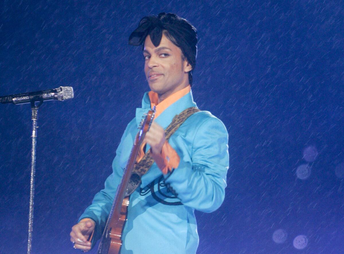 Prince performs during the halftime show at the Super Bowl XLI in 2007.