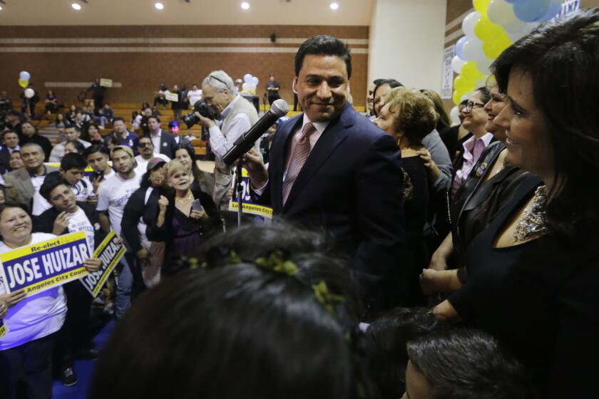 LOS ANGELES, CA MAR. 03, 2015 Incumbant LA City Councilmember Jose Huizar acknowledging his wife Richelle Ros at the election headquarter at Salesian High School in LA on Mar. 03, 2015. LA City Council District 14 is a highly publicized race between former LA County Supervisor Gloria Molina and incumbant Jose Huizar (Lawrence K. Ho / Los Angeles Times)