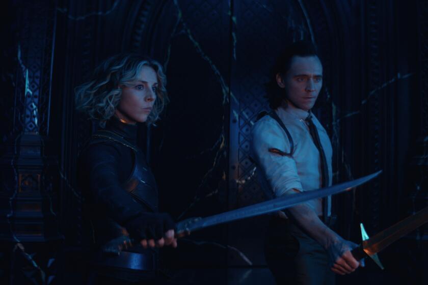 A woman and a man with their swords drawn