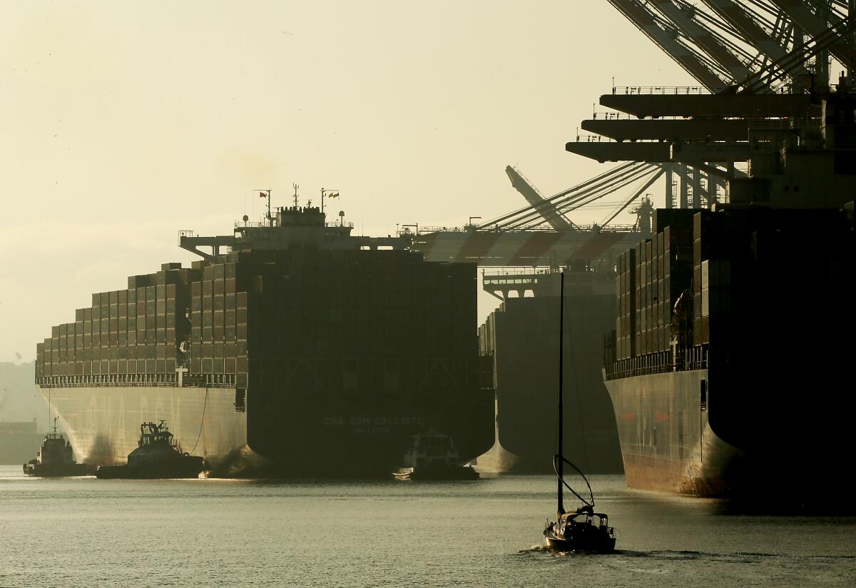 A small boat near a cargo ship