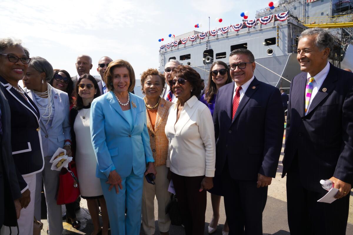 House Speaker Nancy Pelosi meets with guests after the christening of the Navy oiler John Lewis.