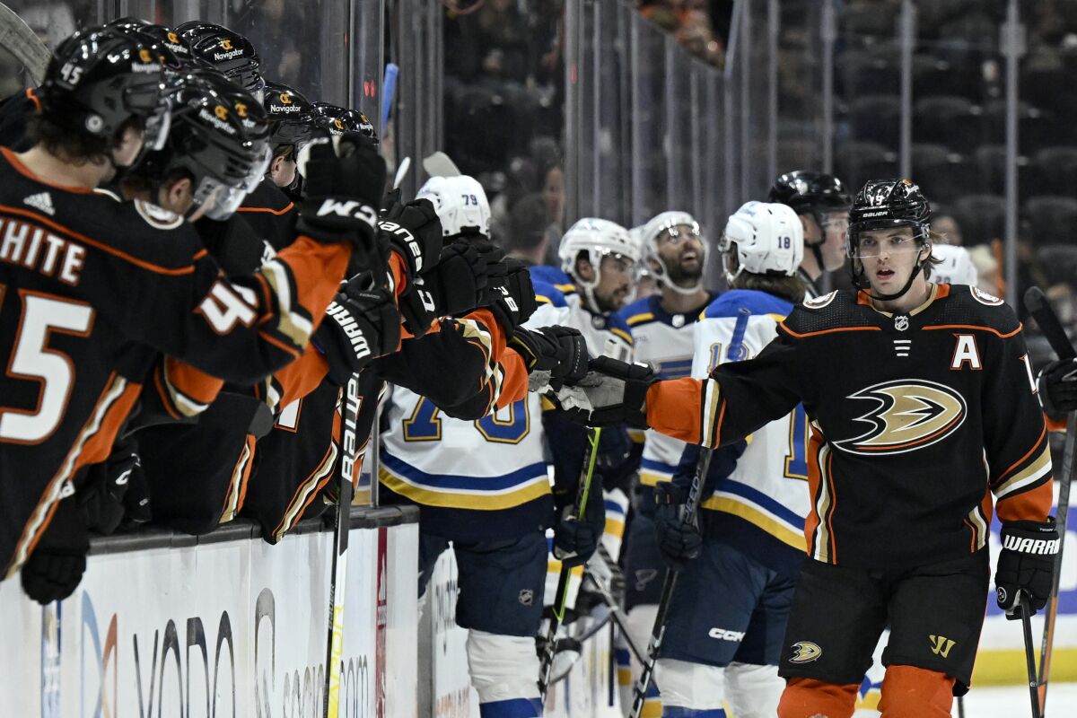 Ducks right wing Troy Terry, right, is congratulated by teammates after scoring a goal in the first period March 25, 2023. 