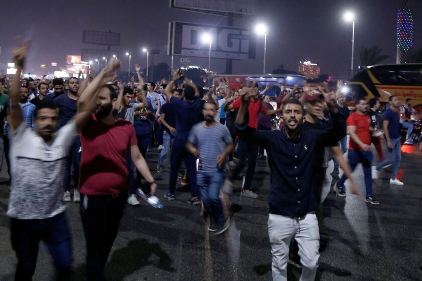 Egyptian protesters shout slogans as they take part in a protest calling for the removal of President Abdel Fattah al-Sisi in Cairo's downtown on September 20, 2019. - Protestors also gathered in other Egyptian cities calling for the removal of President Abdel Fattah al-Sisi but police quickly dispersed them. In Cairo dozens of people joined night-time demonstrations around Tahrir Square -- the epicenter of the 2011 revolution that toppled the country's long-time autocratic leader.