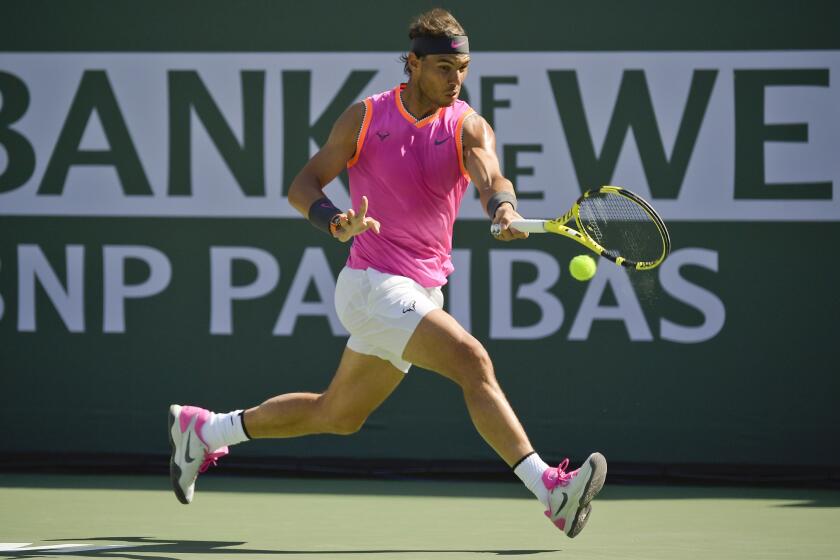FILE - Rafael Nadal, of Spain, hits a forehand to Karen Khachanov, of Russia, at the BNP Paribas Open tennis tournament in Indian Wells, Calif., in this Friday, March 15, 2019, file photo. The BNP Paribas Open, featuring the men’s and women’s pro tennis tours, won’t be held in March as originally scheduled. Tournament organizers said Tuesday, Dc. 29, 2020, they are working with the ATP and WTA tours as well as the title sponsor to confirm dates later in 2021 for the event in Indian Wells, California. (AP Photo/Mark J. Terrill, File)