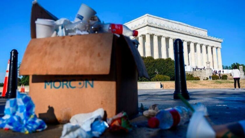 Trash spills over a box near the Lincoln Memorial. With most members of Congress gone for the holidays, it was virtually certain that a partial government shutdown would persist into 2019.