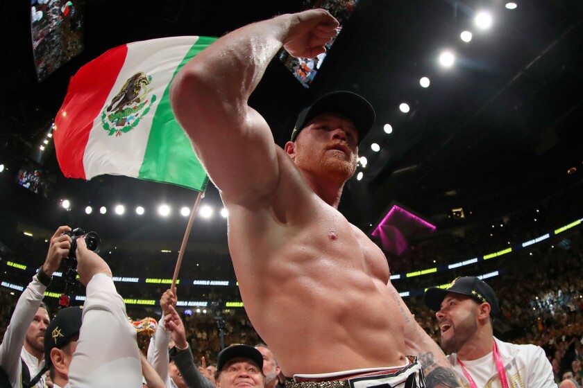 Canelo Alvarez celebrates after his unanimous decision win over Daniel Jacobs in their middleweight unification fight at T-Mobile Arena on May 4 in Las Vegas.
