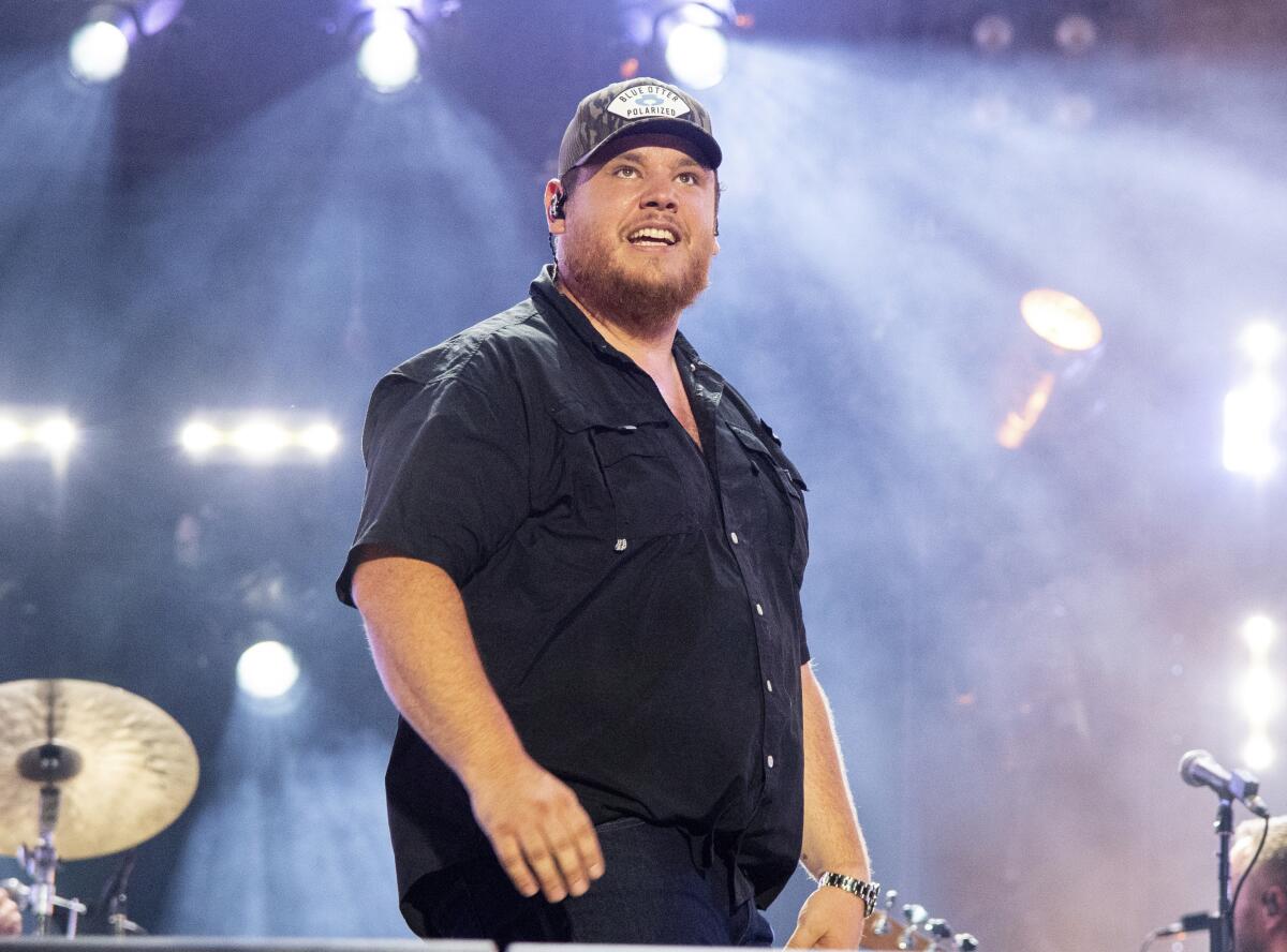 FILE - Luke Combs performs during CMA Fest 2022, June 11, 2022, in Nashville, Tenn. Combs leads the nominees for the 2024 Academy of Country Music Awards with eight nods to his name, it was announced Tuesday, April 9, 2024. (Photo by Amy Harris/Invision/AP, File)