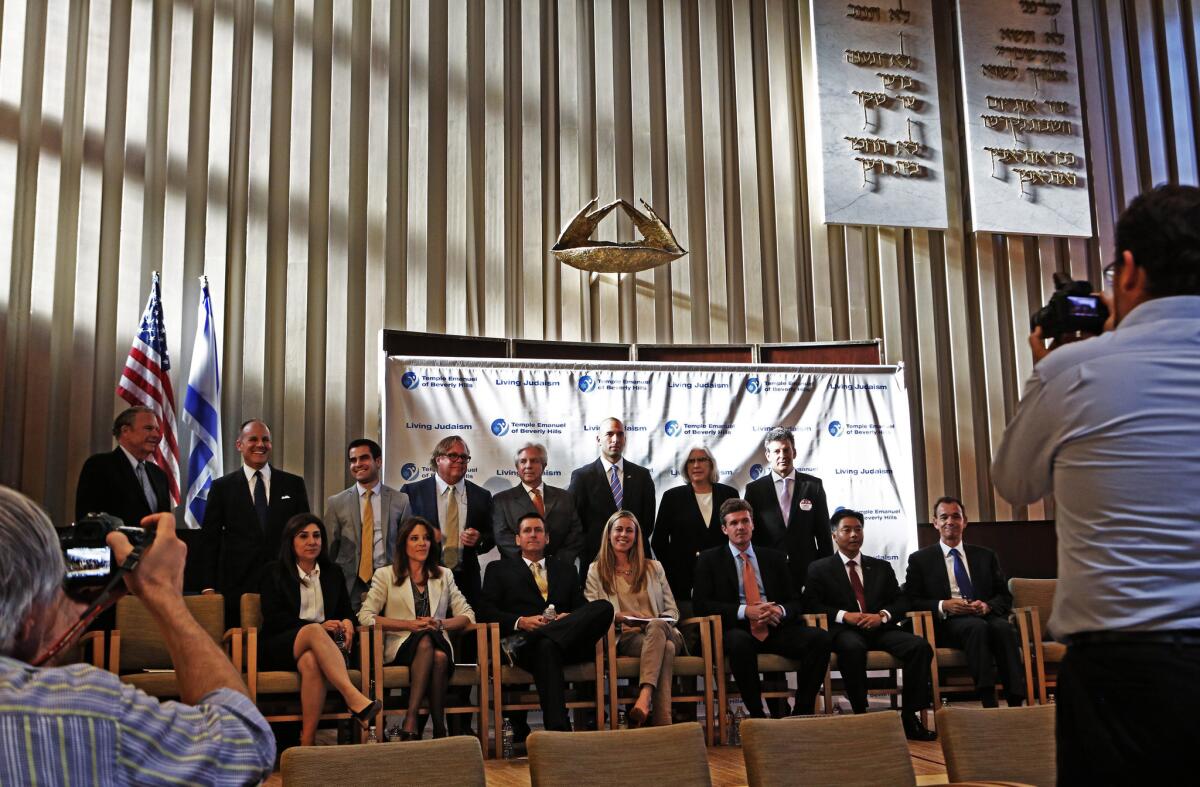 Many of the candidates seeking to succeed Rep. Henry Waxman (D-Beverly Hills) take a group photo before a recent forum.
