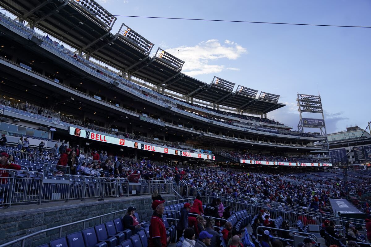 The lights went out forcing a brief delay in the start of a baseball game between the Washington Nationals and the New York Mets at Nationals Park, Friday, April 8, 2022, in Washington. (AP Photo/Alex Brandon)
