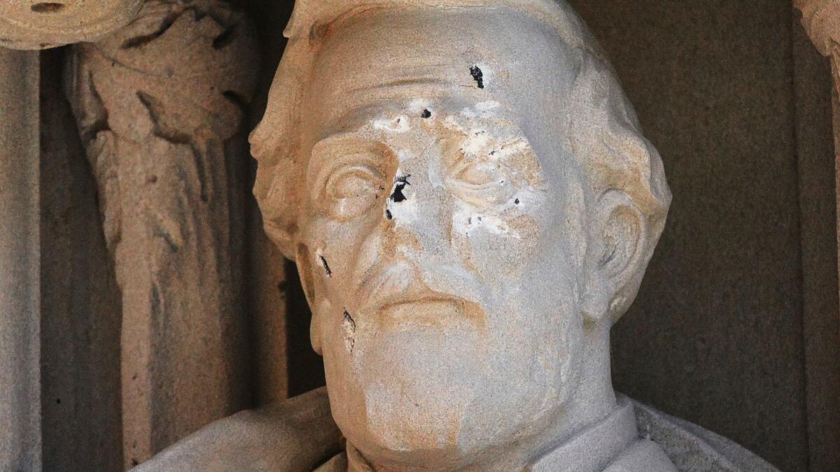 The vandalized statue of Confederate Gen. Robert E. Lee statue at the Duke Chapel on Aug. 17, 2017, in Durham, N.C.