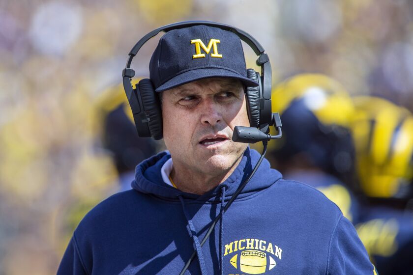 FILE - This Sept. 7, 2019, file photo, Michigan head coach Jim Harbaugh watches from the sideline.