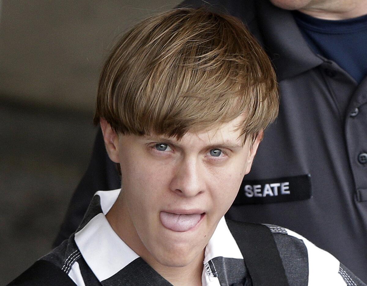 In this June 18, 2015, photo, Charleston, S.C., shooting suspect Dylann Storm Roof is escorted from the Cleveland County Courthouse in Shelby, N.C.