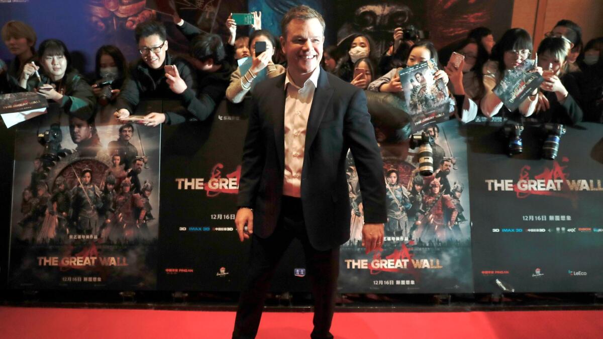 Actor Matt Damon smiles in front of Chinese fans as he arrives at a red carpet event for the movie "The Great Wall" in Beijing on Dec. 6, 2016.