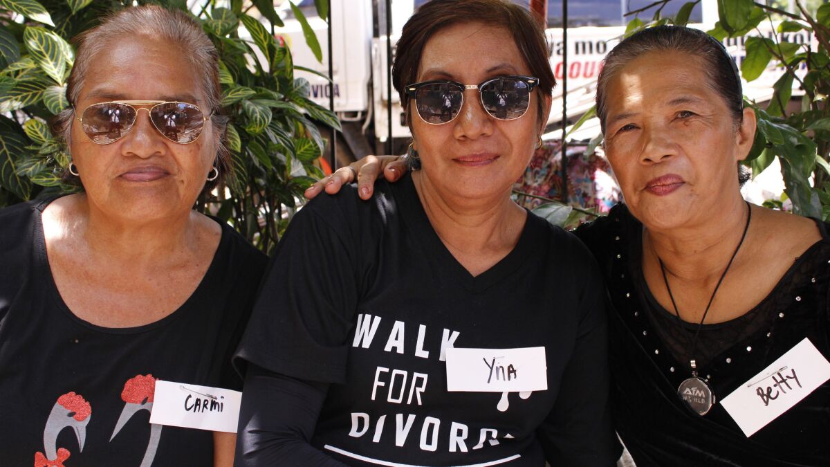 A retired overseas worker, Yna Vertudazo, 60, center, is joined by her friends Carmi Bantilo, 68, and Betty Robianes, 64.