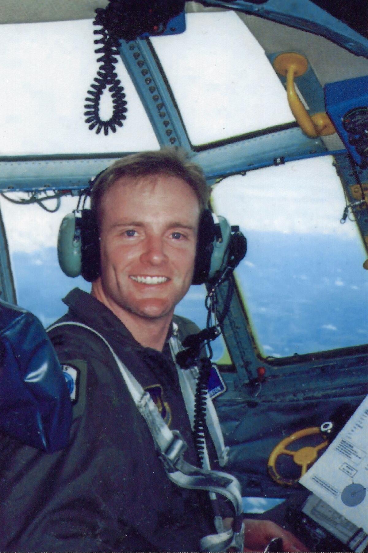 Johnson flies a C-130 military transport aircraft in an unspecified location over Europe sometime in 2000.