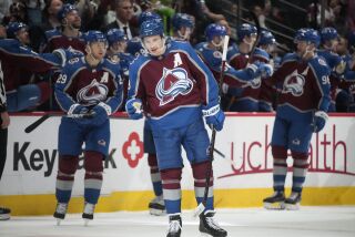 Colorado Avalanche defenseman Cale Makar, center, gestures after scoring a goal against the Detroit Red Wings in the second period of an NHL hockey game Monday, Jan. 16, 2023, in Denver. (AP Photo/David Zalubowski)