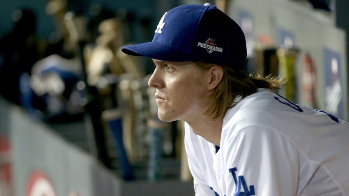 Dodgers starter Zack Greinke watches his teammates bat against the Mets during their Game 2 win on Saturday.