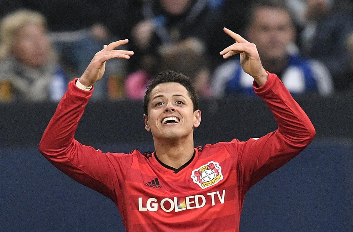 Bayern Leverkusen’s Javier Hernandez of Mexico celebrates after scoring a goal during a match against FC Schalke 04 on April 23.