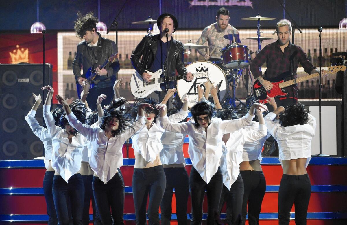 Joe Trohman, left, Patrick Stump, Andy Hurley and Pete Wentz of Fall Out Boy perform at the Billboard Music Awards at the MGM Grand Garden Arena in Las Vegas.