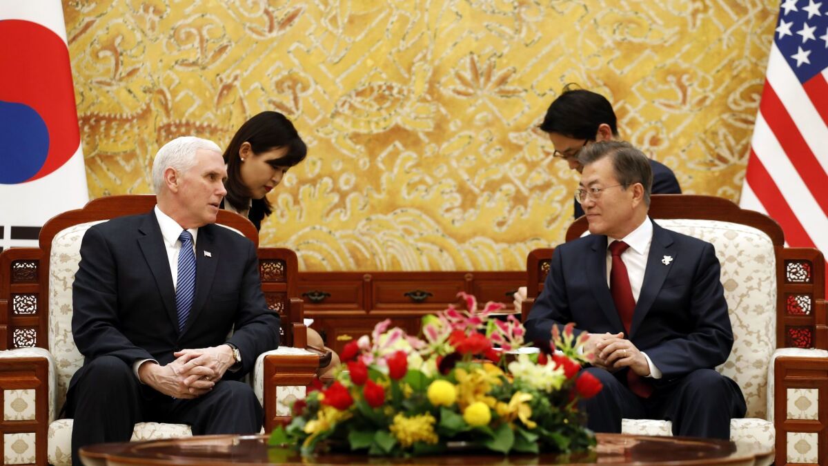 Vice President Mike Pence talks to South Korean President Moon Jae-in during their meeting at the presidential Blue House in Seoul on Thursday.