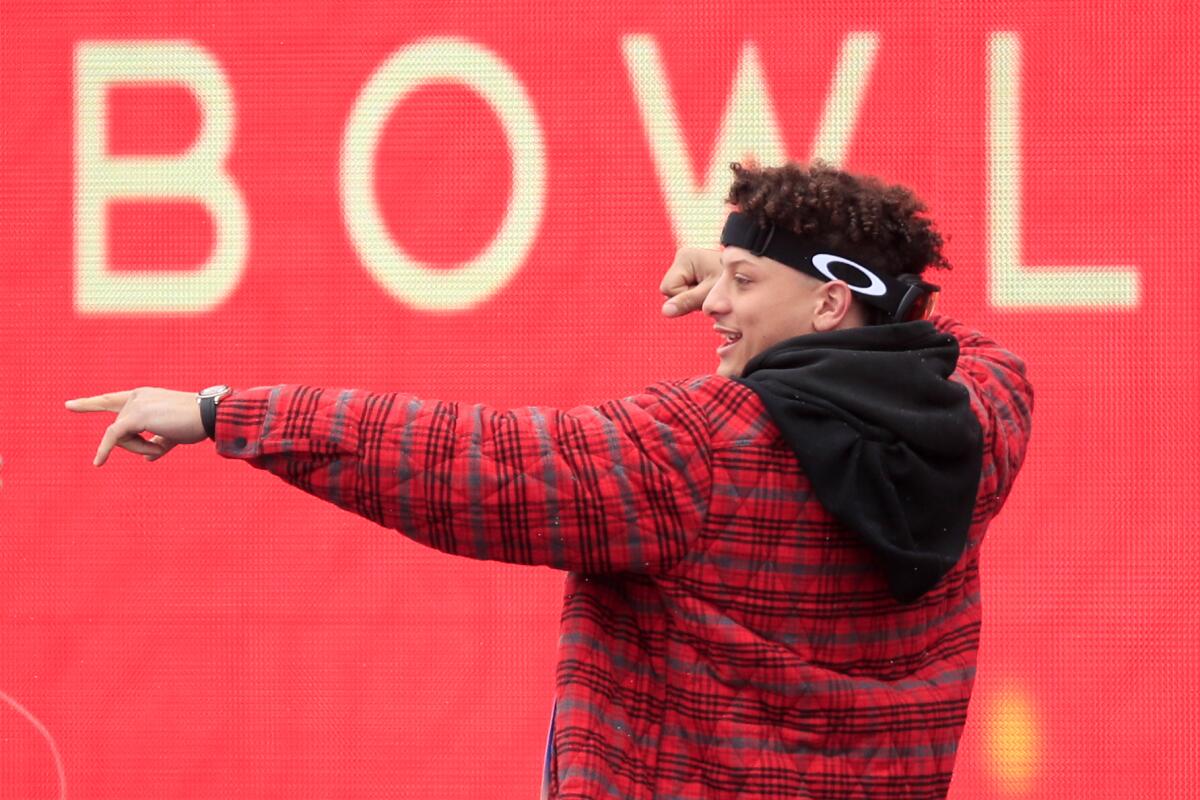 Kansas City Chiefs quarterback Patrick Mahomes, a member of More Than a Vote, celebrates during a Super Bowl parade