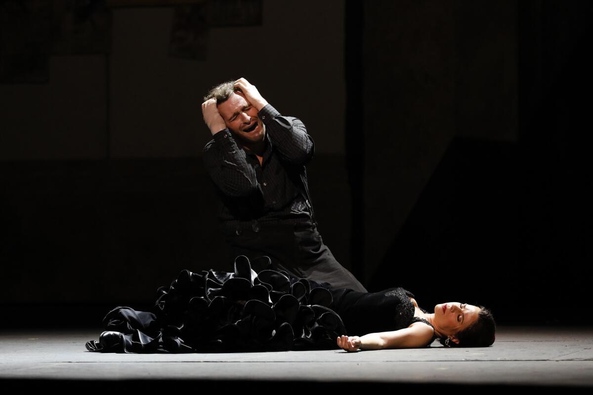 Don Jose (Riccardo Massi) weeps after killing Carmen (Ana María Martinez) in Los Angeles Opera's "Carmen" at the Dorothy Chandler Pavilion.