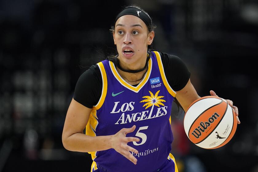 Los Angeles Sparks forward Dearica Hamby dribbles down the court during the first half.