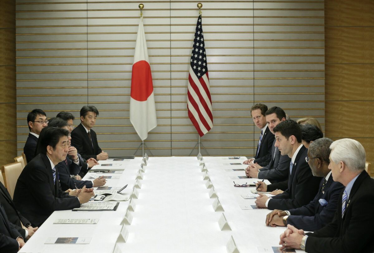 Rep. Paul Ryan, third from right, speaking with Japanese Prime Minister Shinzo Abe about the Trans-Pacific Partnership and other issues at Abe's official residence in Tokyo last month.