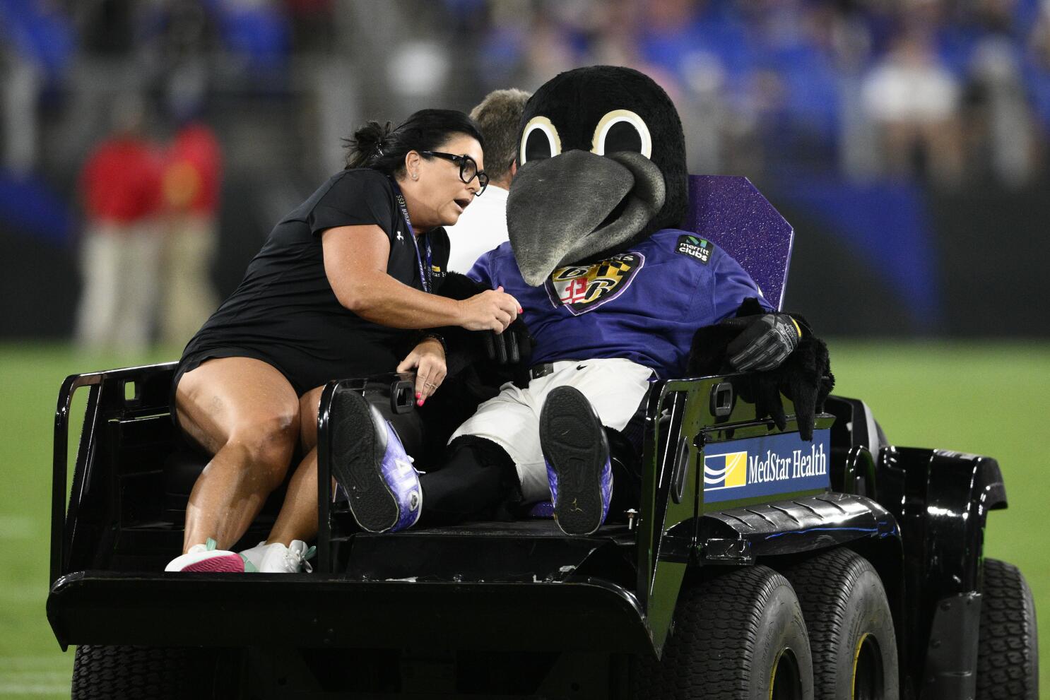 Ravens' mascot carted off at halftime with apparent injury