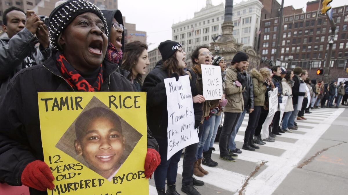 Demonstrators in Cleveland protest the police shooting of 12-year-old Tamir Rice. (Tony Dejak / Associated Press)