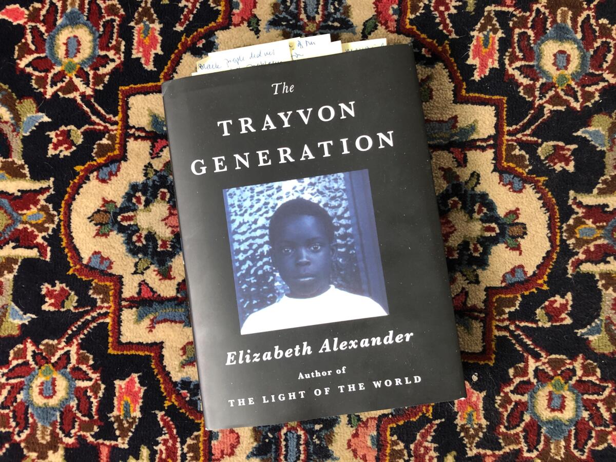 The book cover for "The Trayvon Generation" shows a blue-tinted photograph of a young Black boy looking wary.