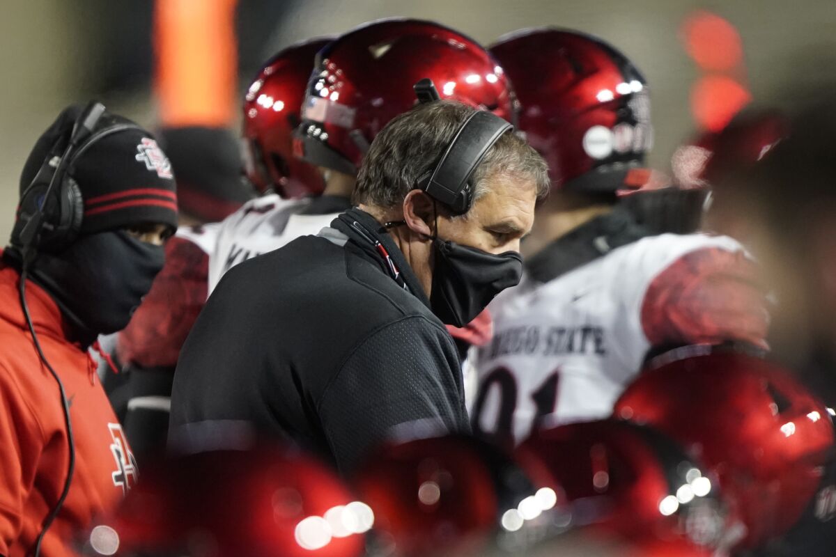 San Diego State head coach Brady Hoke talks to his defense during Saturday night's game against BYU.