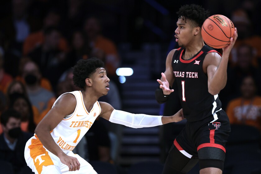 Texas Tech guard Terrence Shannon Jr. looks to pass around Tennessee guard Kennedy Chandler during the first half of an NCAA college basketball game in the Jimmy V Classic on Tuesday, Dec. 7, 2021, in New York. (AP Photo/Adam Hunger)