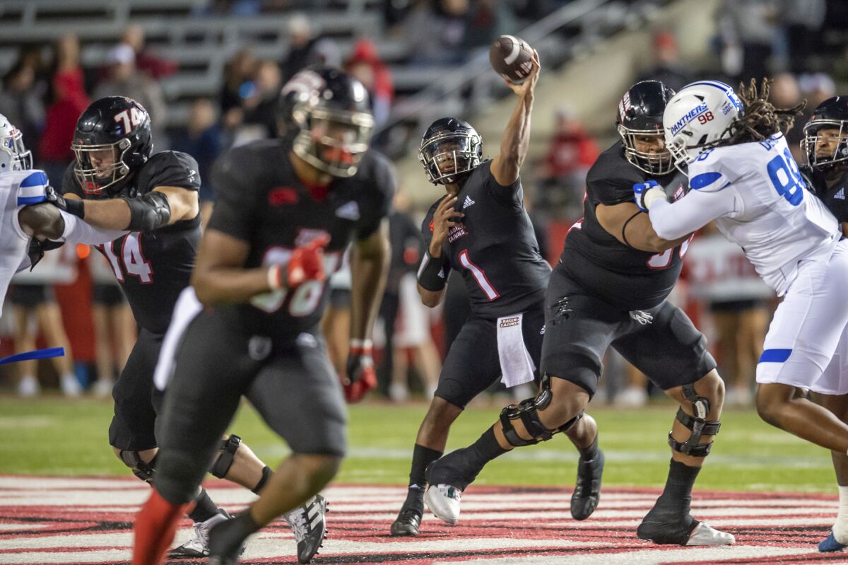 Louisiana-Lafayette quarterback Levi Lewis throws a pass against Georgia State during an NCAA college football game Thursday, Nov. 4, 2021, in Lafayette, La. (Scott Clause/The Daily Advertiser via AP)