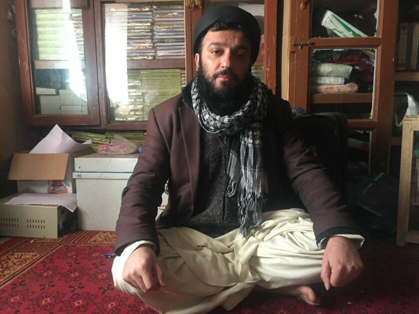 Abdullah Habdi, a member of the Sufi order, is shown Sunday in the library of the Sufi center in Kabul, Afghanistan, site of an attack that killed as many as 11 people.