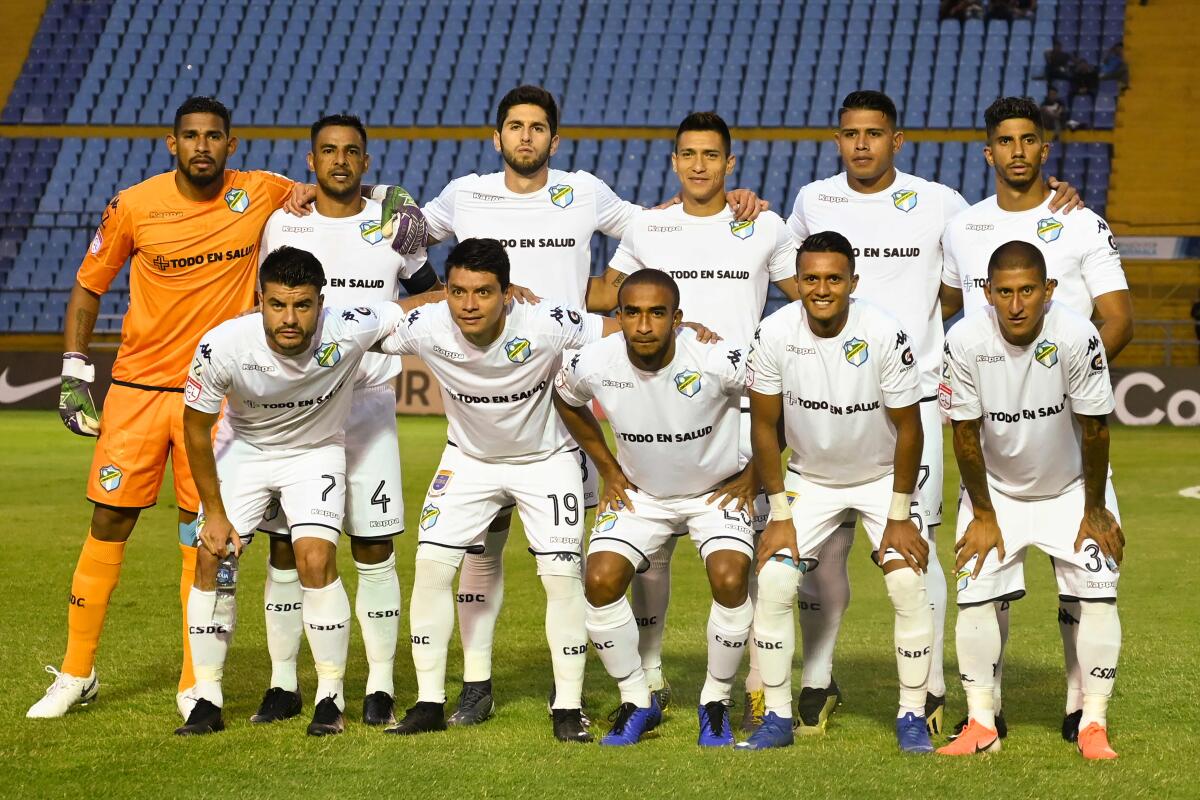 Guatemala's Comunicaciones players pose for pictures during a Concacaf  