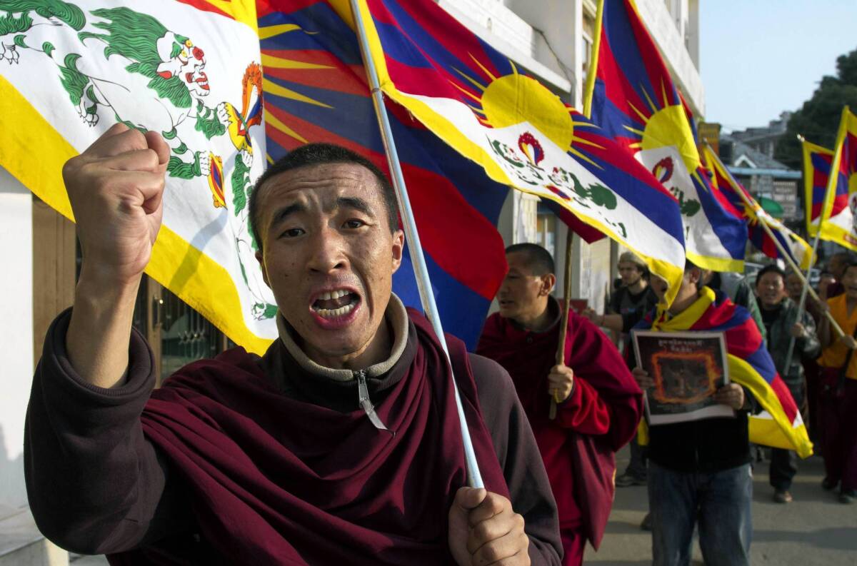 A Tibetan exile shouts slogans during a demonstration in Dharamsala, India, to show solidarity with Tibetans who immolated themselves to protest Chinese rule.